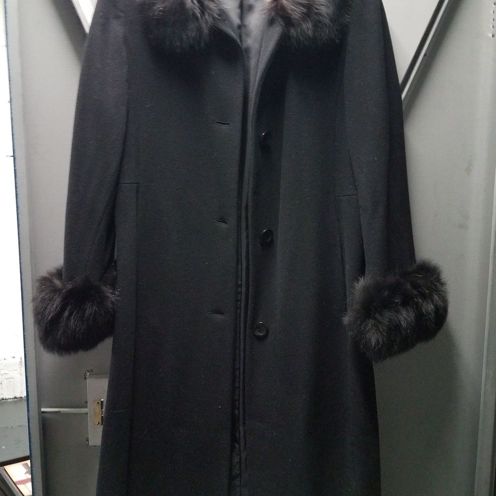 Long coat with fur around the neck and sleeves